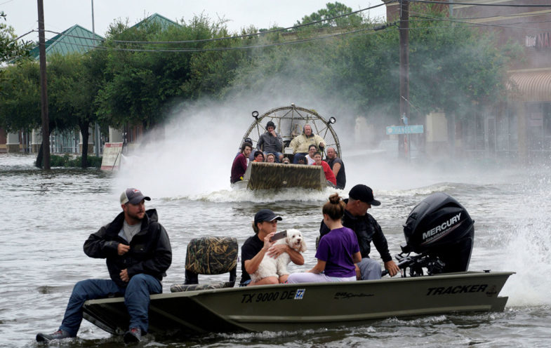 People are rescued from flood waters from Hurricane Harvey on an air boat in Dickinson, Texas August 27, 2017